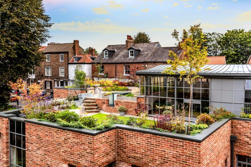 A Garden on the Roof of a Brick Building